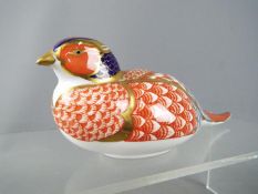 Royal Crown Derby - a paperweight in the form of a Pheasant, gold stoppper to gthe base, 17.