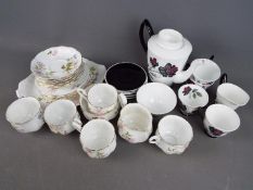 A quantity of Royal Albert 'Masquerade' pattern comprising coffee pot, six saucers, four cups,