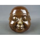 A brass four faced Buddha.