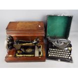 An antique Singer sewing machine, serial number V523088,