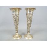 A pair of Edward VII hallmarked silver trumpet shaped vases by William Comyns, London assay 1901,