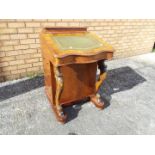 A serpentine front davenport desk with inset gilt tooled, green leather writing surface,