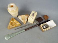 A mixed lot of collectables to include hallmarked silver napkin ring, silver handled button hook,