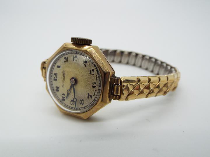 A 9ct gold cased lady's, Thomas Russell & Son, wristwatch having octagonal case,