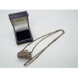 A miniature silver coin purse on silver chain, both stamped 925, purse approximately 3.5 cm (l).