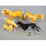 Beswick - A collection of Beswick horse and foal figurines, four Palomino and one other.