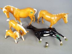 Beswick - A collection of Beswick horse and foal figurines, four Palomino and one other.