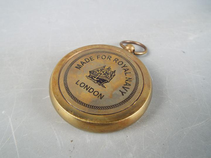 A brass compass marked 'Royal Navy' in box. - Image 3 of 3