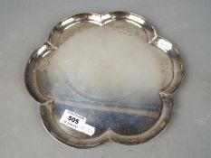 A hallmarked silver salver in the form of a flowerhead, Chester assay 1962,