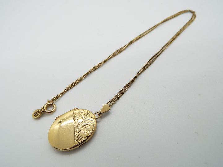 A 9ct gold locket pendant and necklace, 45 cm (l), approximately 6.5 grams all in.