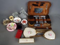 A mixed lot to include a gentleman's travelling grooming set, dressing table set, glassware,