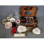 A mixed lot to include a gentleman's travelling grooming set, dressing table set, glassware,