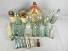 A quantity of vintage glass bottles and a stoneware jug 'The Lancashire Botanical Brewery Co Ltd'