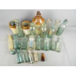 A quantity of vintage glass bottles and a stoneware jug 'The Lancashire Botanical Brewery Co Ltd'