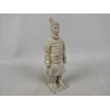 A reproduction Chinese terracotta warrior figure, approximately 21.