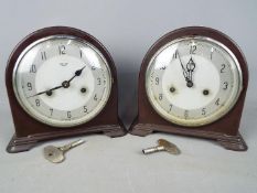 A pair of Smiths bakelite cased mantel clocks, with keys and pendulums.