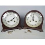 A pair of Smiths bakelite cased mantel clocks, with keys and pendulums.