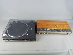 A Bang & Olufsen Beomaster 1000 and a Technics SL BD22D turntable.