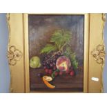 A framed oil on canvas still life of fruit and foliage, approximately 35 cm x 25 cm image size.