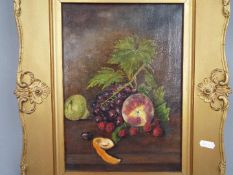 A framed oil on canvas still life of fruit and foliage, approximately 35 cm x 25 cm image size.