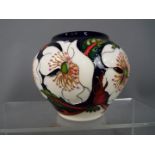 Moorcroft Pottery - a globular vase decorated in the Wayside Rambler pattern,