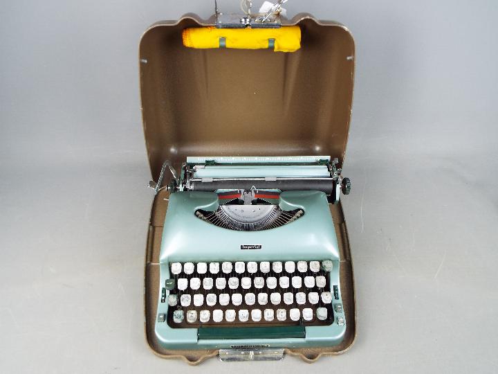 An Imperial 'Good Companion 5' portable typewriter in metal case. - Image 2 of 2