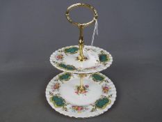 A Royal Albert two tier cake stand in the 'Berkeley' pattern.