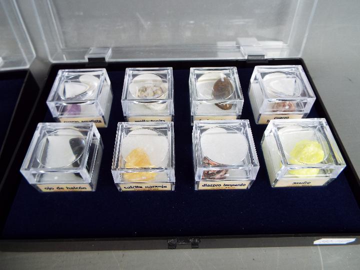 Four display cases, each containing eight boxed mineral samples with labels of origin. - Image 3 of 5