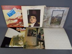 A collection of vinyl comprising Pink Floyd - The Wall (SHDW 411), Ummagumma (SHDW 1/2),