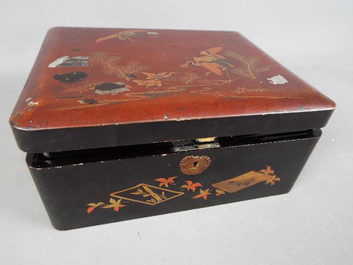 A Japanese lacquered box containing predominantly costume jewellery including bead necklaces, - Image 5 of 5