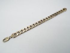 A curb chain bracelet stamped 925, 23 cm (l), approximately 63 grams all in.