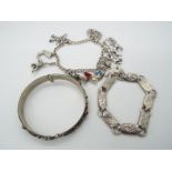 A charm bracelet with eleven continental charms, variously stamped 800, 835 etc,
