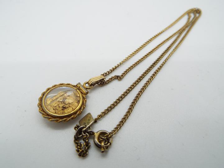 A yellow metal (unmarked) necklace with a 9ct gold pendant with stone set centre, - Image 2 of 4