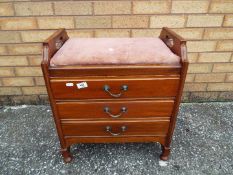 A good quality music stool having three storage drawers.