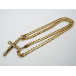 A 9ct gold stone set crucifix pendant with import marks for London on a curb link chain stamped 9kt,