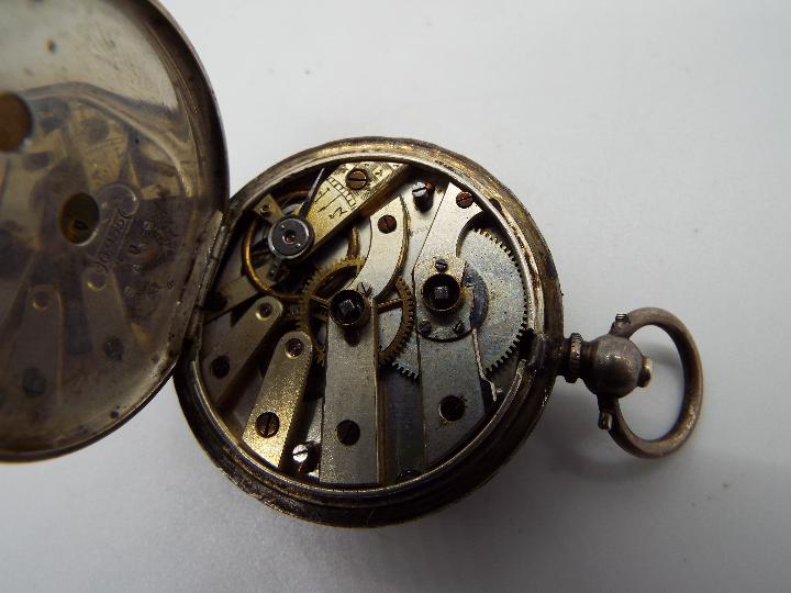 A Swiss silver cased lady's fob watch, 935 fineness, floral and foliate engraved case, - Image 2 of 2