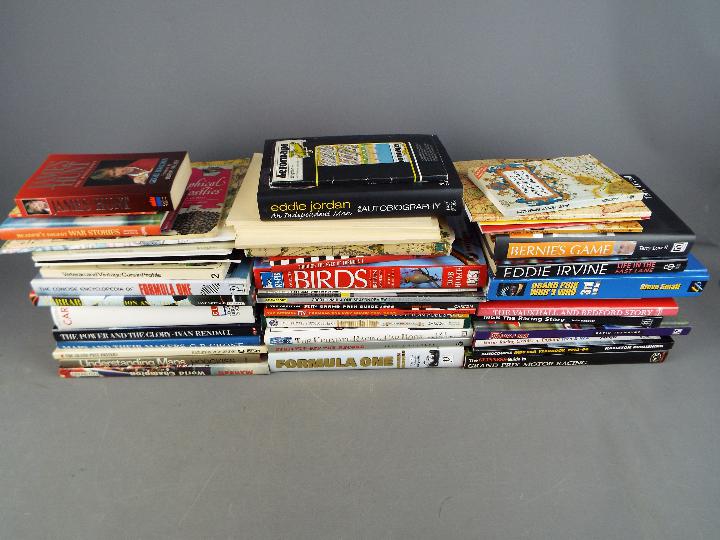 A large quantity of books relating to cartography, motoring, motor sport and other.