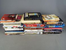 A large quantity of books relating to cartography, motoring, motor sport and other.