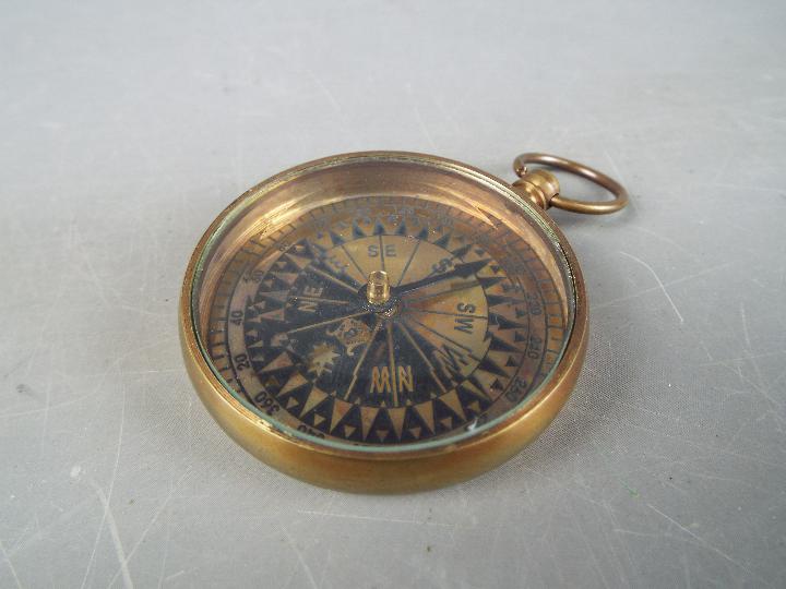 A brass compass marked 'Royal Navy' in box. - Image 2 of 3