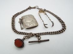 A hallmarked silver watch chain with T bar and swivel fob, Chester assay 1920, a silver vesta case,
