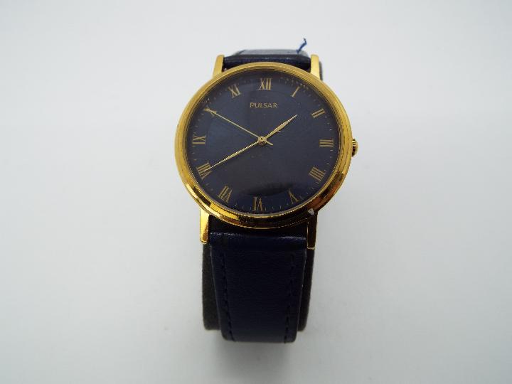 A gentleman's Pulsar wristwatch, Roman numerals to a blue dial, on blue leather strap, boxed. - Image 2 of 3