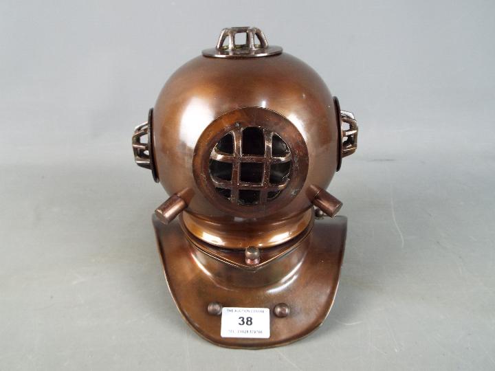 A metal reproduction of a diver's helmet,