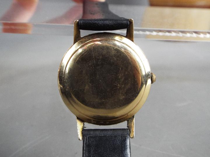 A gentleman's, yellow metal, Smiths Imperial wristwatch with black dial and 19 jewel movement, - Image 5 of 5