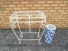 A painted metal plant stand, approximately 74 cm x 66 cm x 32 cm,