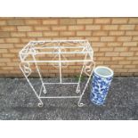 A painted metal plant stand, approximately 74 cm x 66 cm x 32 cm,