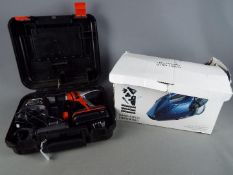 A Black & Decker power drill and accessories in carry case and a boxed Lakeland hand held vacuum