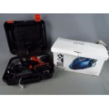 A Black & Decker power drill and accessories in carry case and a boxed Lakeland hand held vacuum