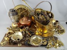 A large quantity of metalware comprising brass, copper, plated ware and similar,