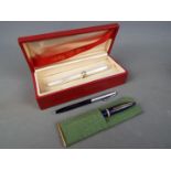 A boxed Lady Sheaffer fountain pen, a Mentmore Paramount with 14ct nib and a Sheaffer ballpoint.