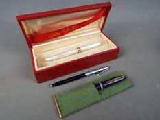 A boxed Lady Sheaffer fountain pen, a Mentmore Paramount with 14ct nib and a Sheaffer ballpoint.